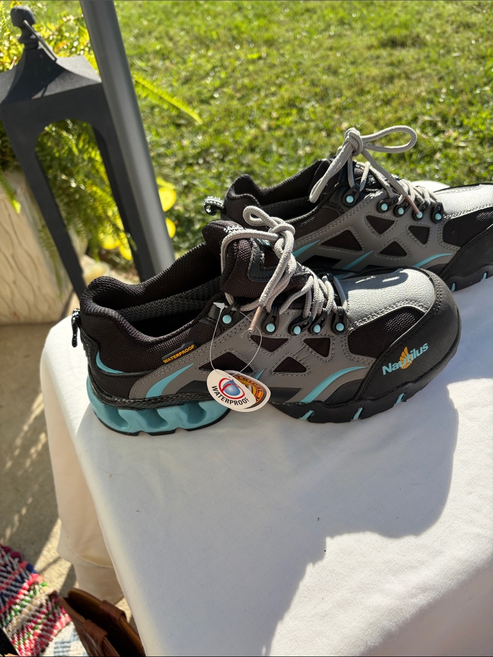 Nautilus woman’s Black and Teal Waterproof steel toe Sneakers